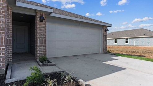 Single story brick home with a two car garage