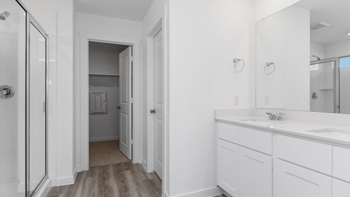 Primary bathroom with shower and double sinks
