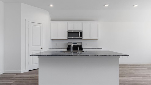 Kitchen with large island with a deep sink