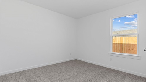 Secondary bedroom with large window