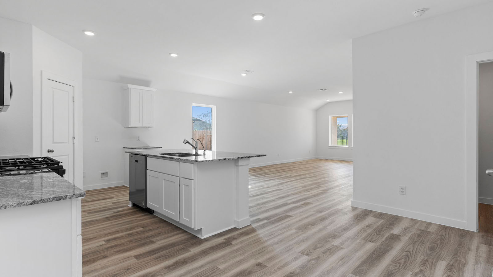 Open concept kitchen, dining, and living room