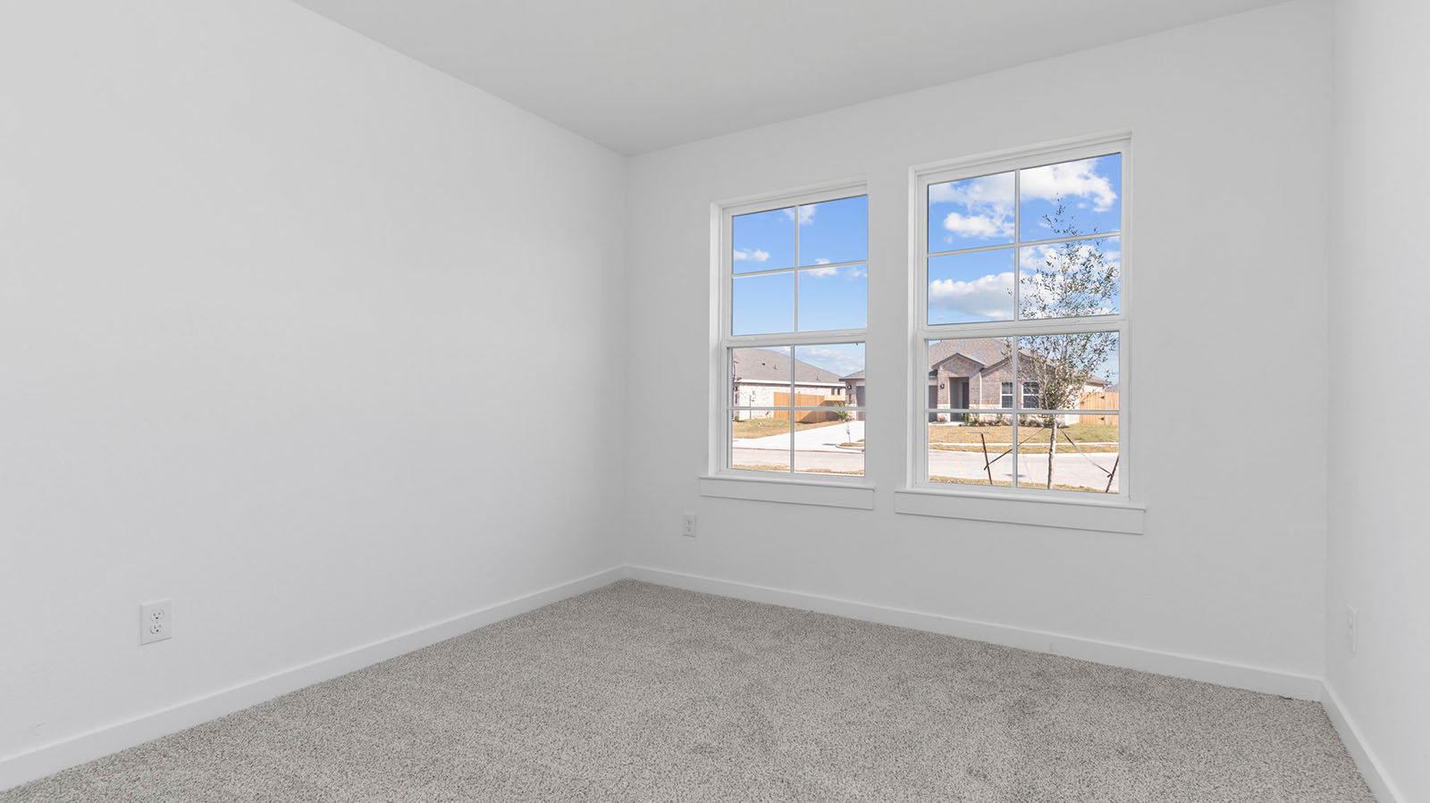 Secondary bedroom with two large window
