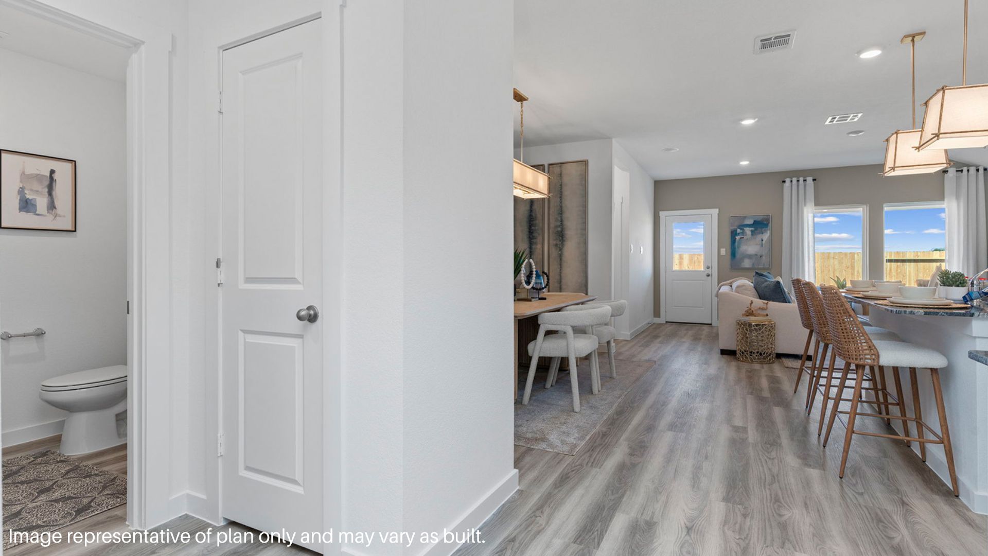 Entryway to the Foyer to the Living room and Kitchen