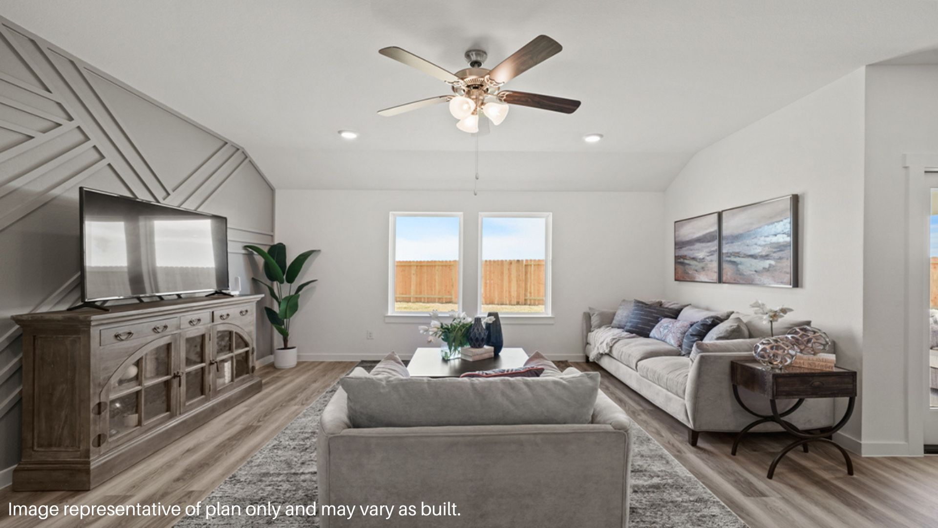 Spacious living room with large windows and plenty of space to entertain