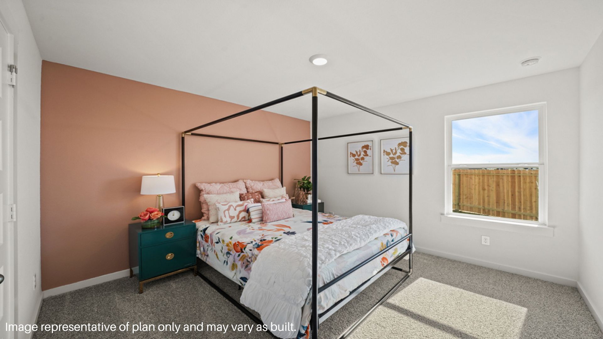 Secondary bedroom with large window that brings in natural light.
