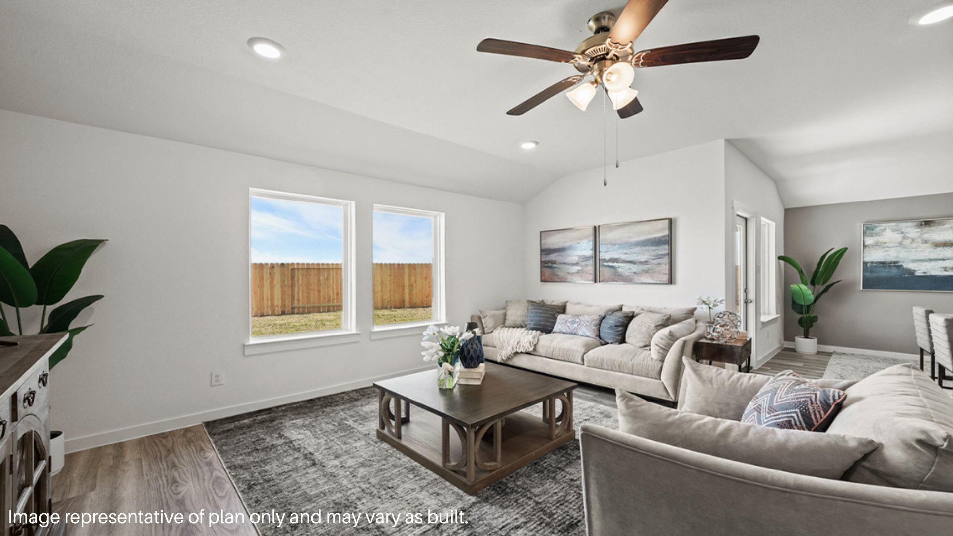 Spacious living room with large windows and plenty of space to entertain