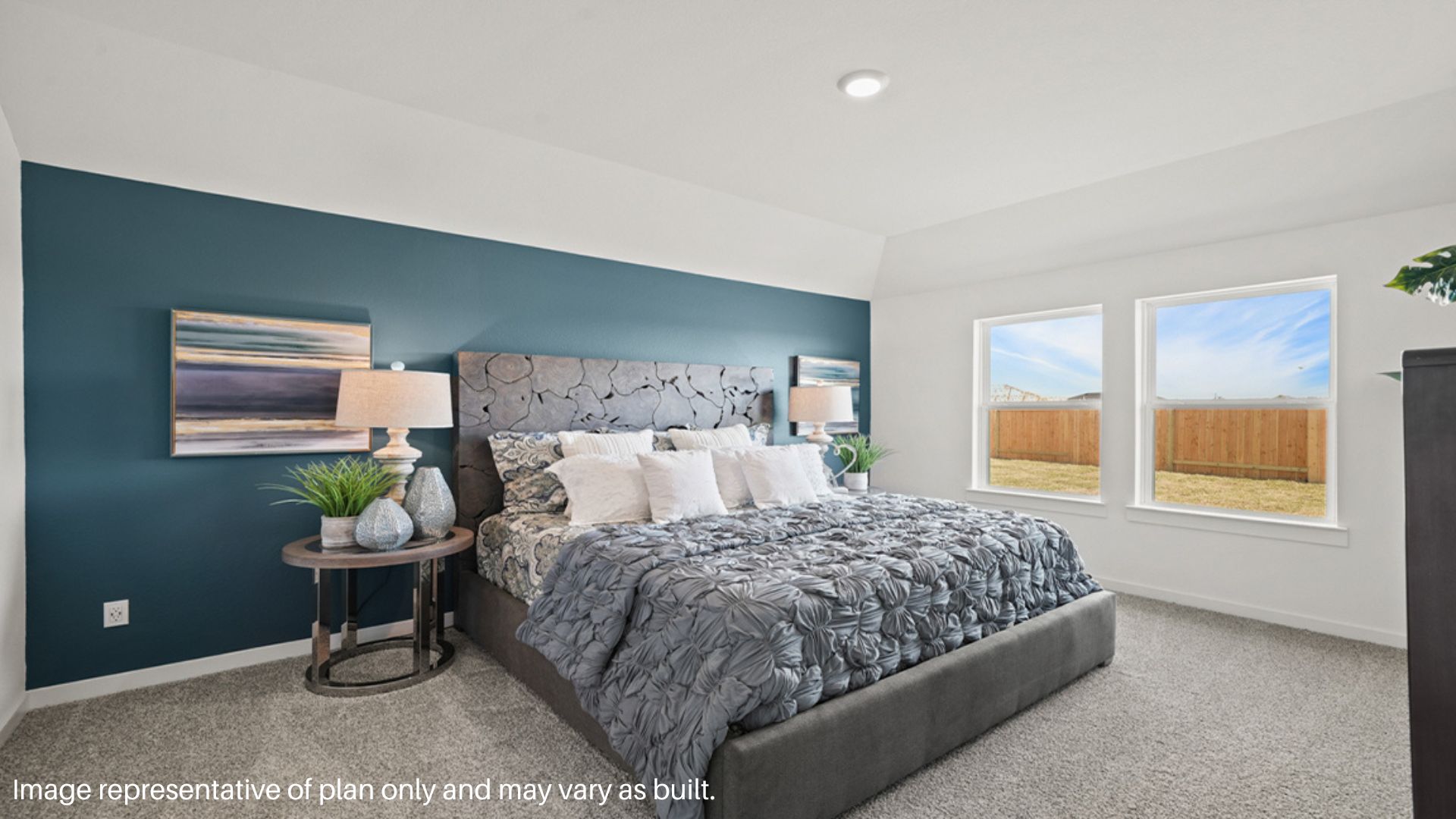 Primary bedroom with large windows