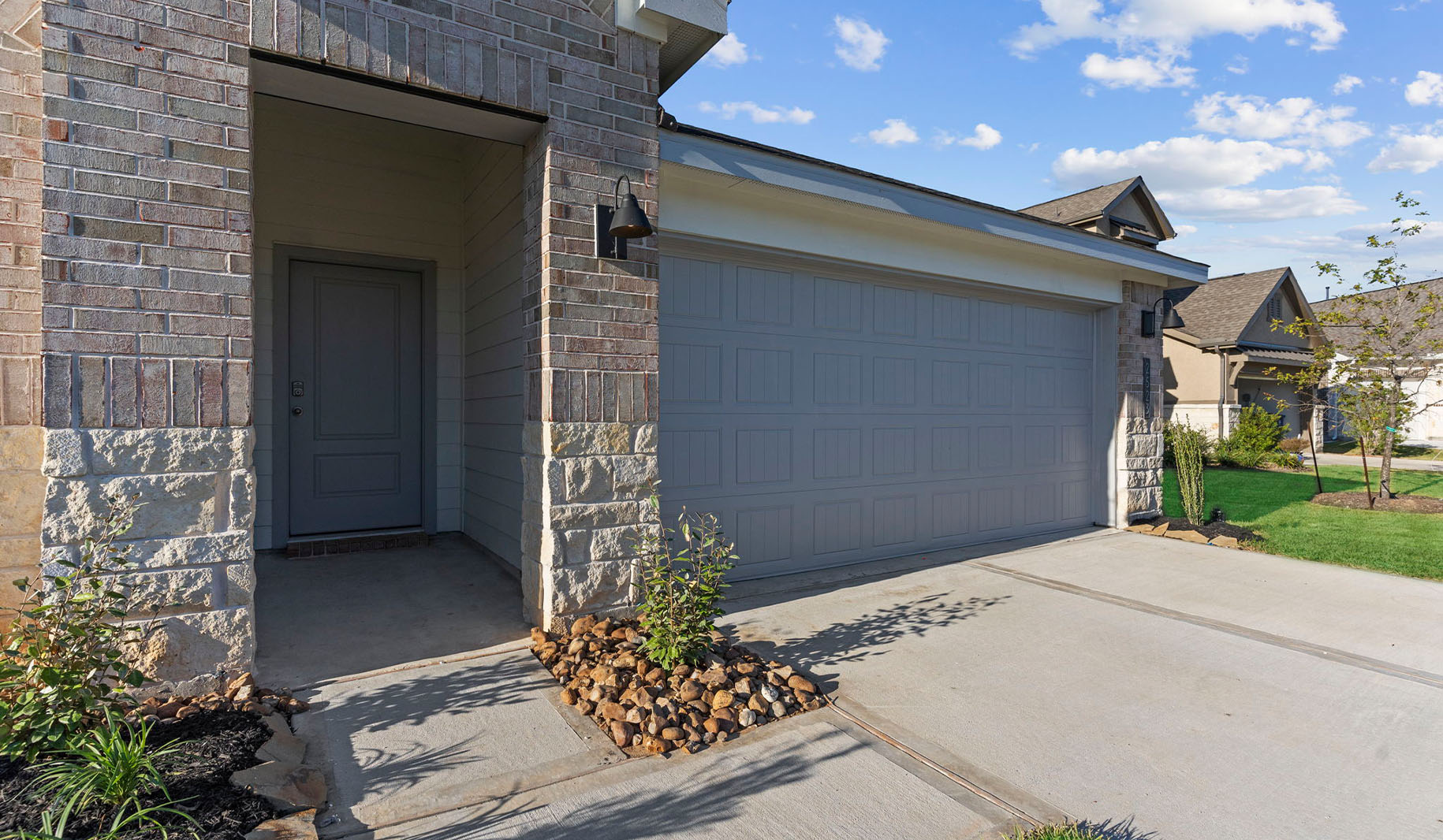 Single story brick home with a two car garage