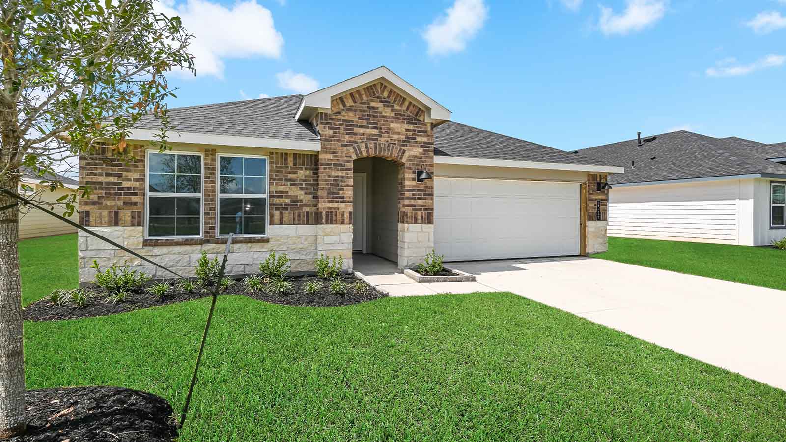 Single story brick home with a two car garge