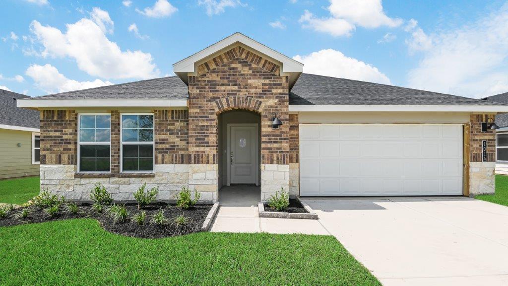 Single story brick home with a two car garge