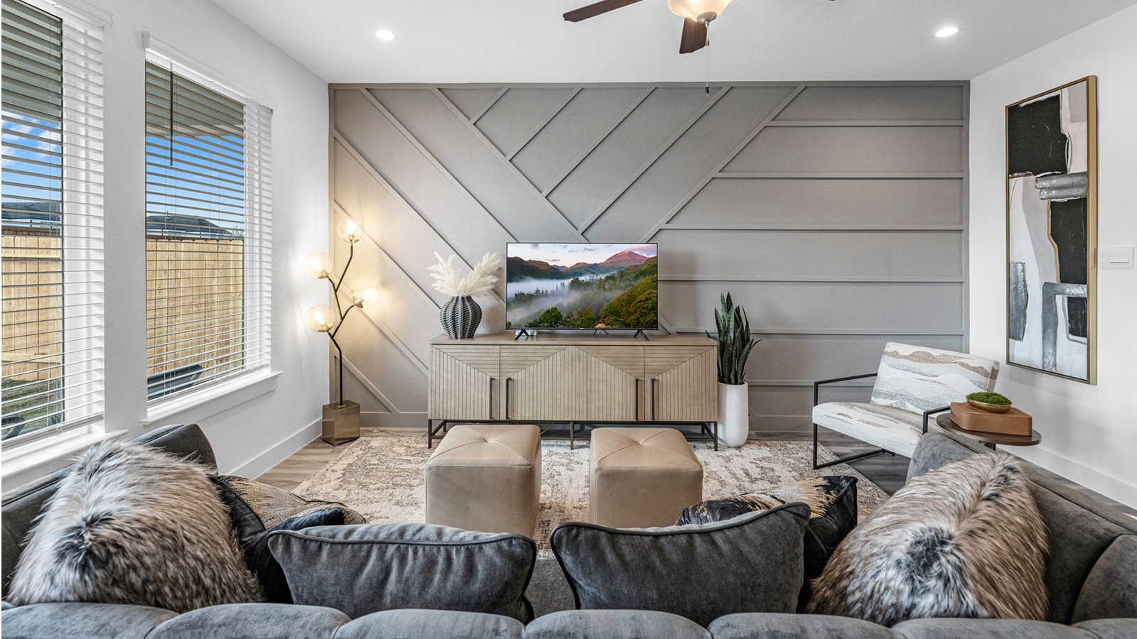 A well-organized living room that includes a kitchen and dining area, creating a warm and welcoming environment for gatherings.