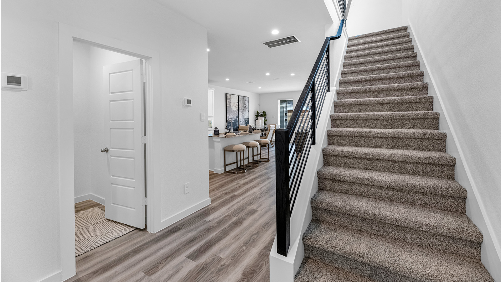 Spacious entry foyer with grand staircase leading to the second floor