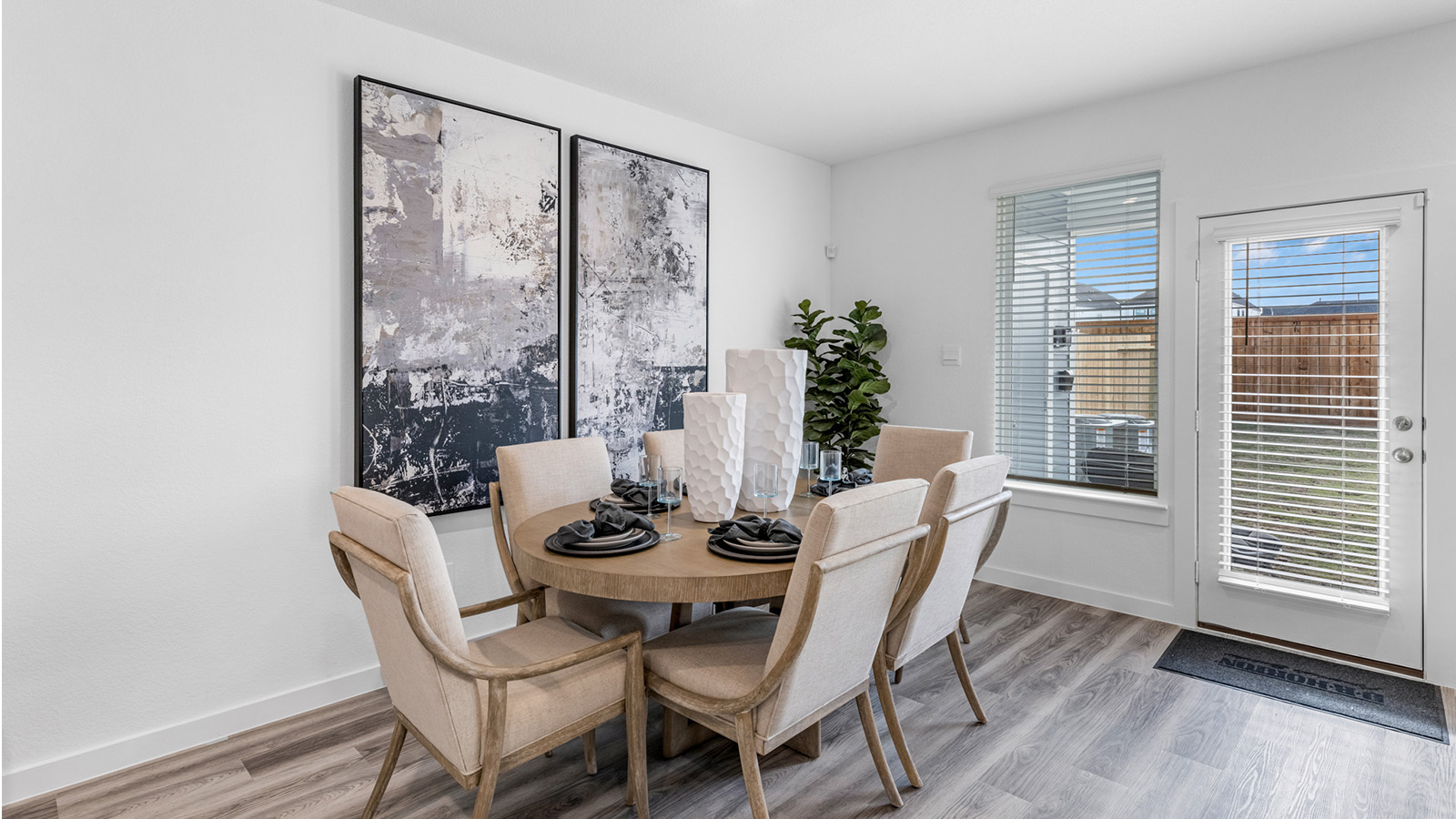 An open concept breakfast room with a large window.