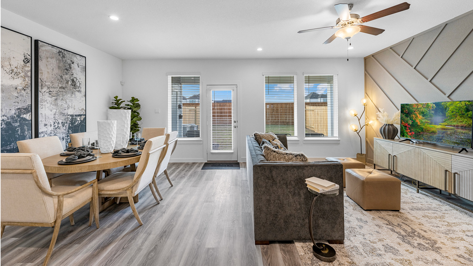 Spacious open concept dining area with vinyl wood flooring and access to the living and kitchen areas