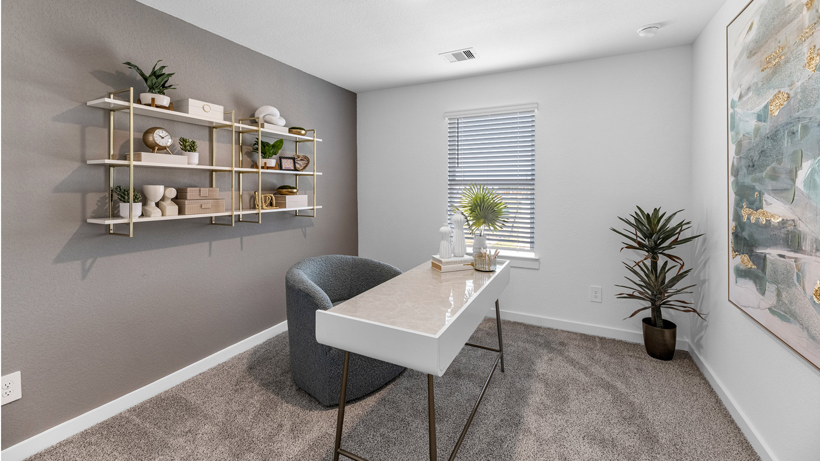 Comfortable guest bedroom featuring neutral-toned walls, carpeted flooring, and a separate closet.