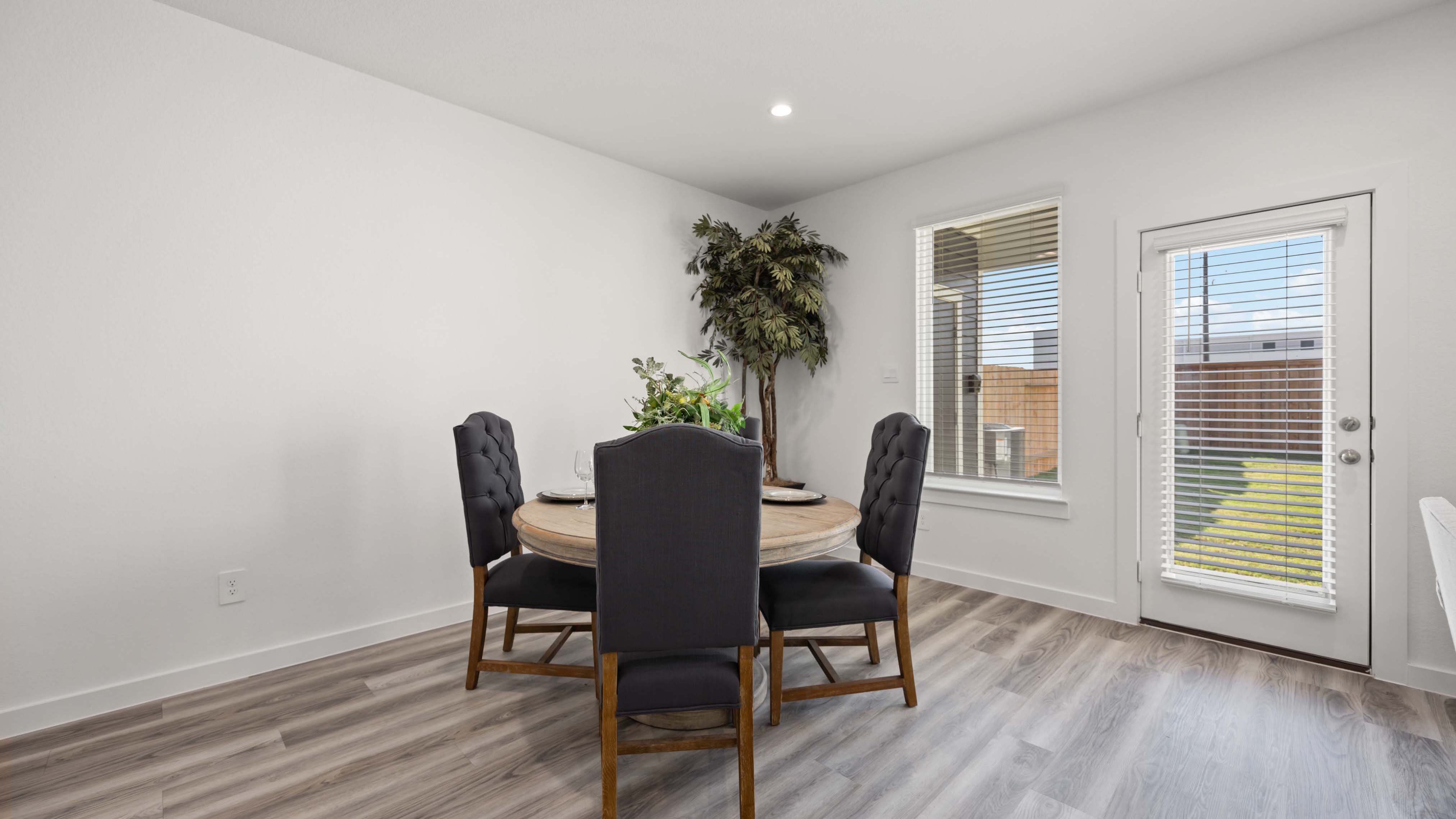 An open concept breakfast room with a large window.