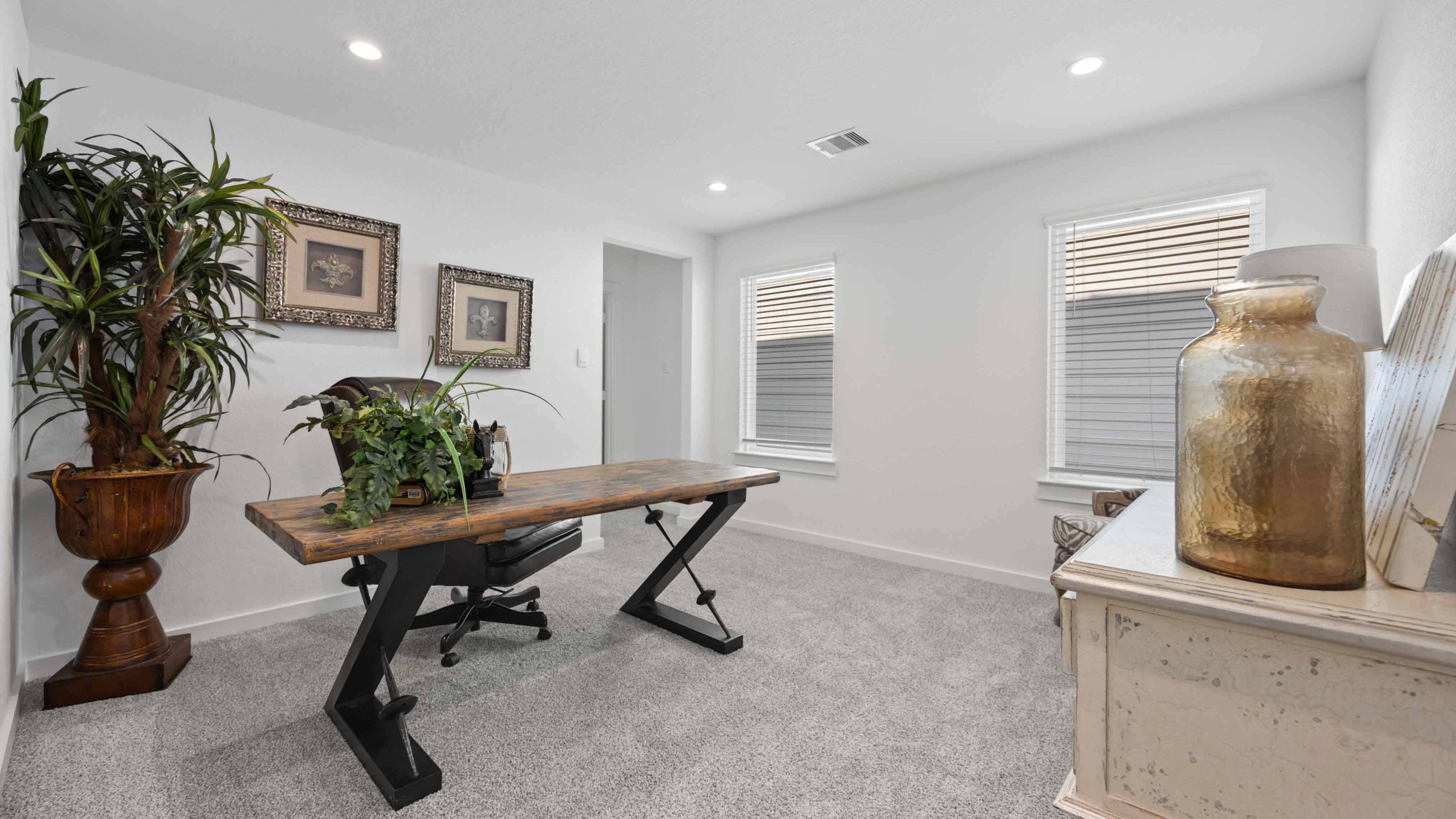 Comfortable guest bedroom featuring neutral-toned walls, carpeted flooring, and a separate closet.