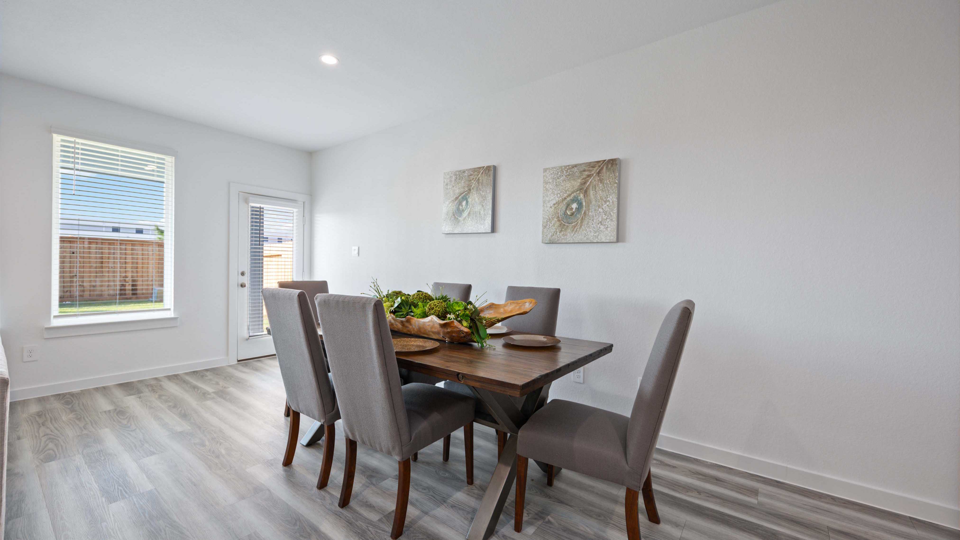 An open concept breakfast room with a large window.