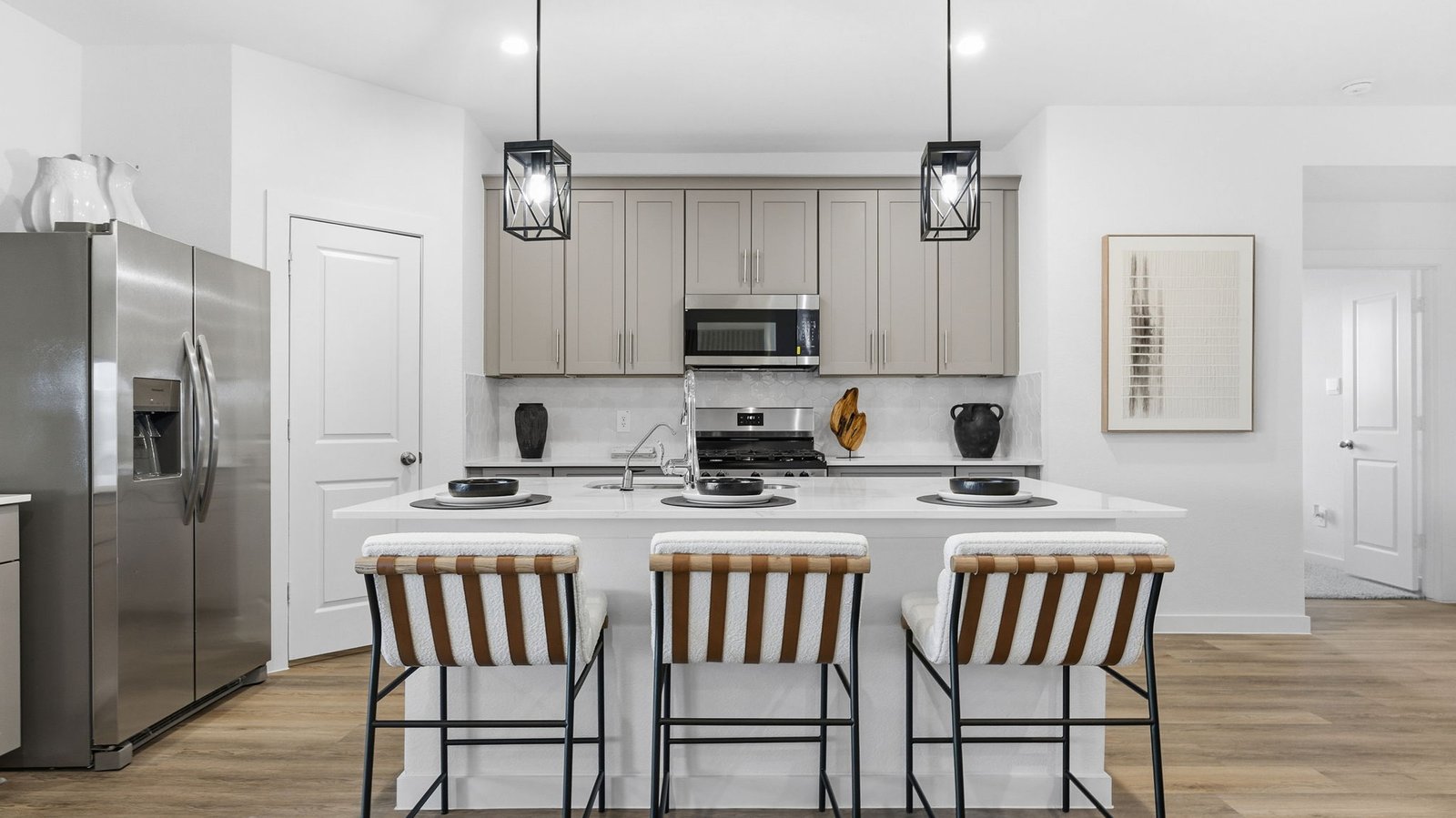 Kitchen adorned with painted cabinets seamlessly integrated into an open dining area layout.
