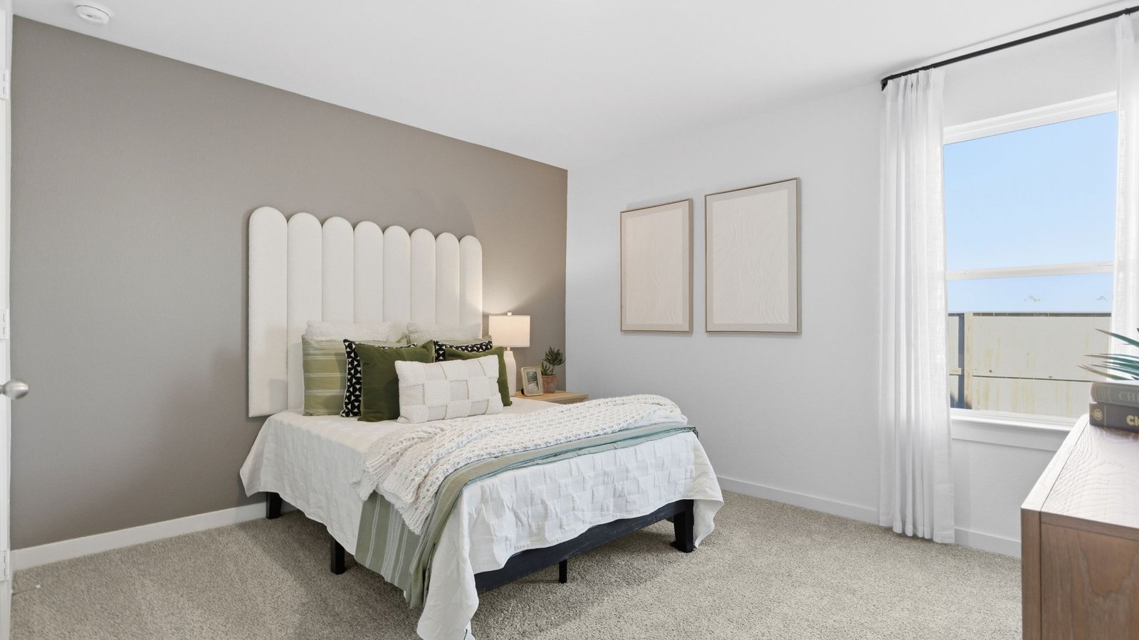 A third bedroom with neutral walls, plush carpet flooring and a separate closet.