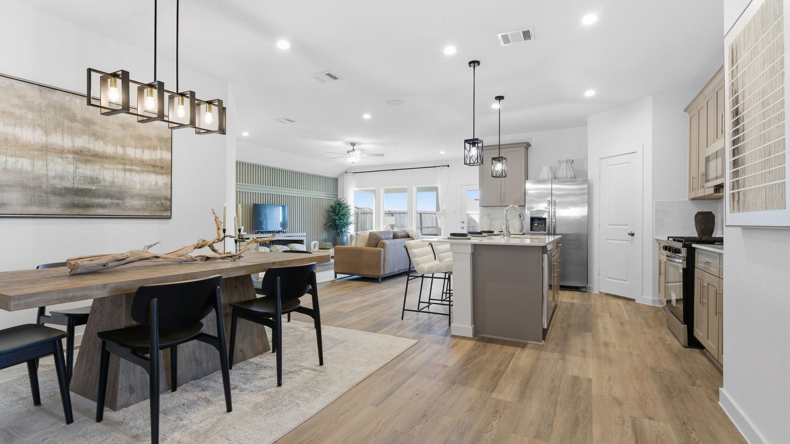 Spacious open concept dining area with vinyl wood flooring and access to the living and kitchen areas