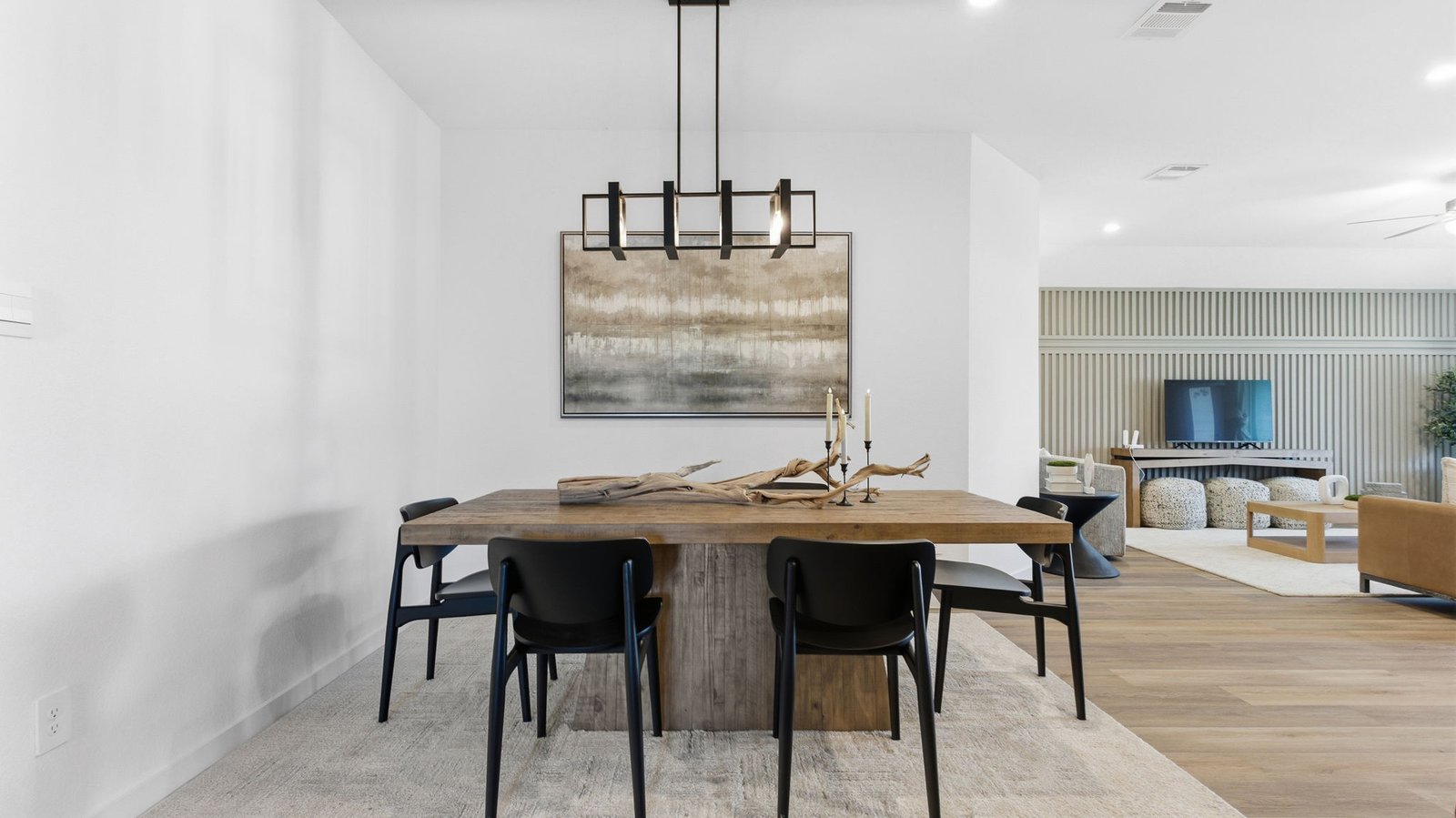 Spacious open concept dining area with vinyl wood flooring and access to the living and kitchen areas