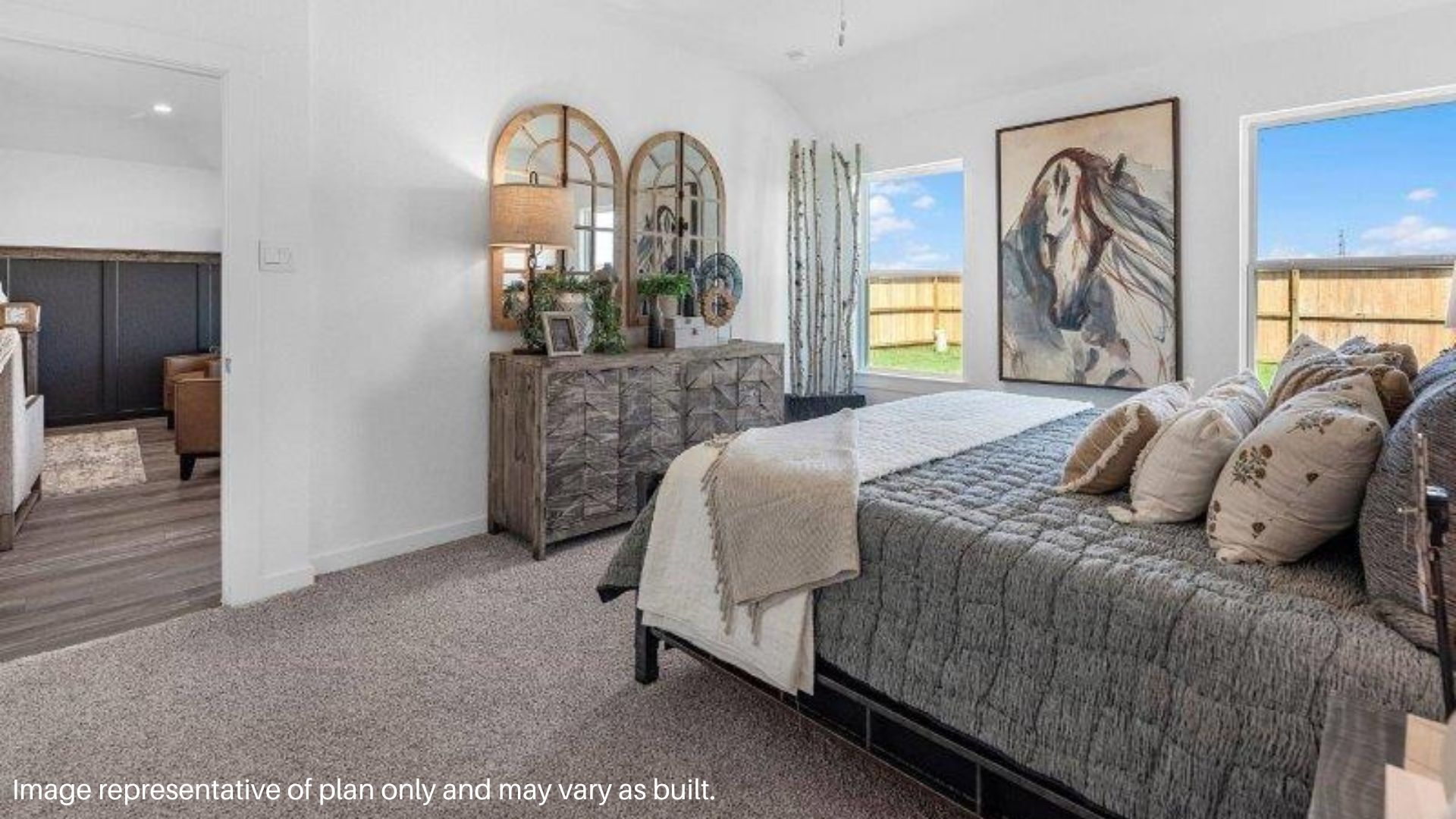 Spacious Primary Bedroom with Large windows that bring in natural lighting