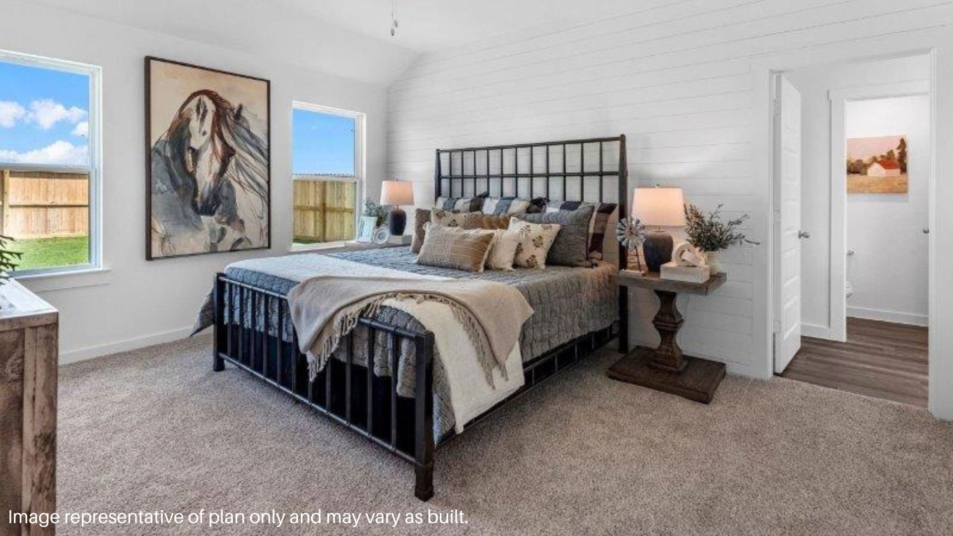 Spacious Primary Bedroom with Large windows that bring in natural lighting
