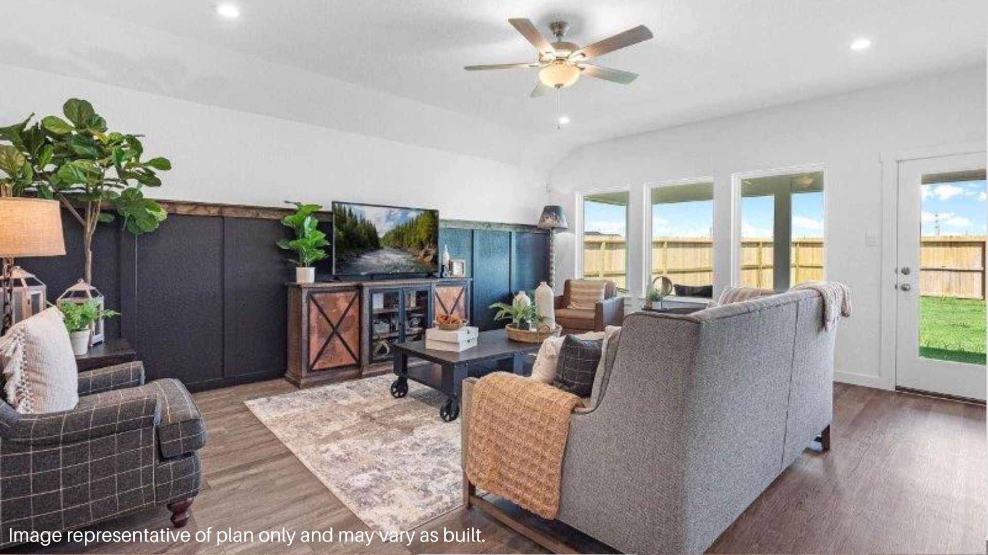 Beautiful Spacious living room with large windows that overlooks the backyard and Patio