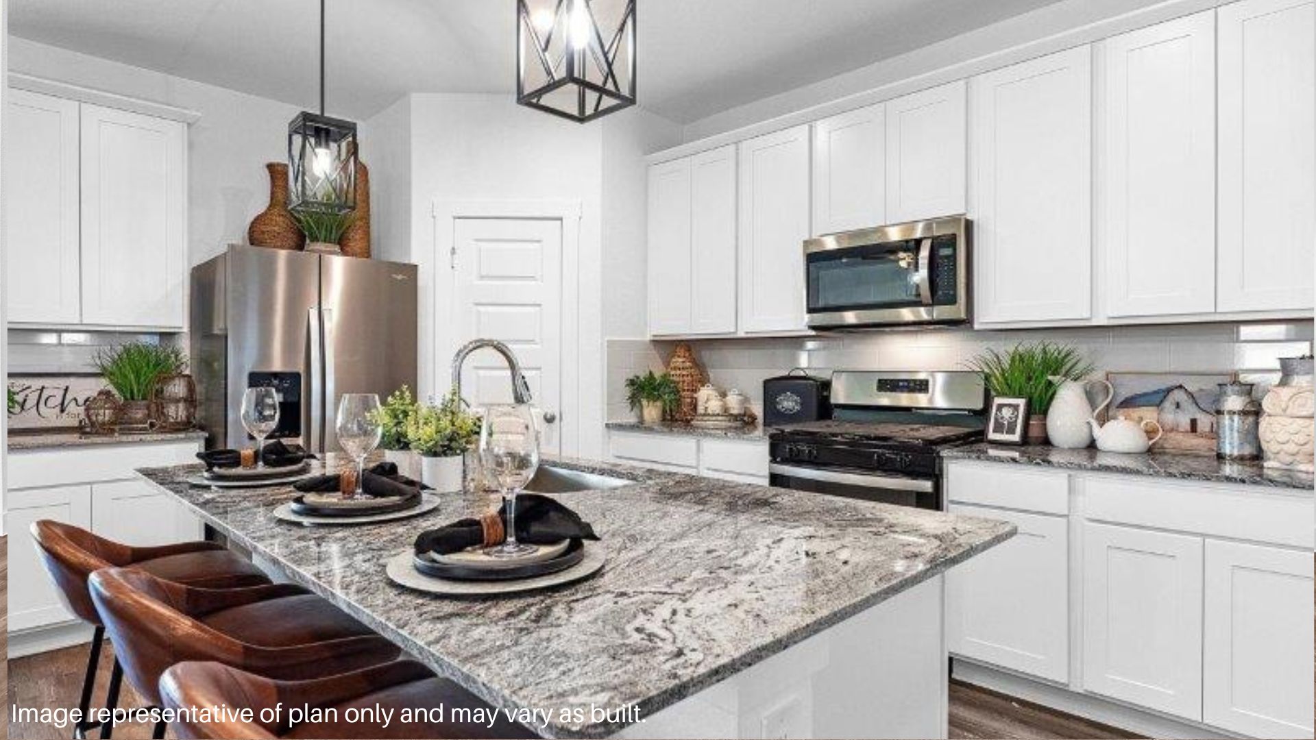 Center Island in Kitchen with White Cabinets and Stainless steel appliances