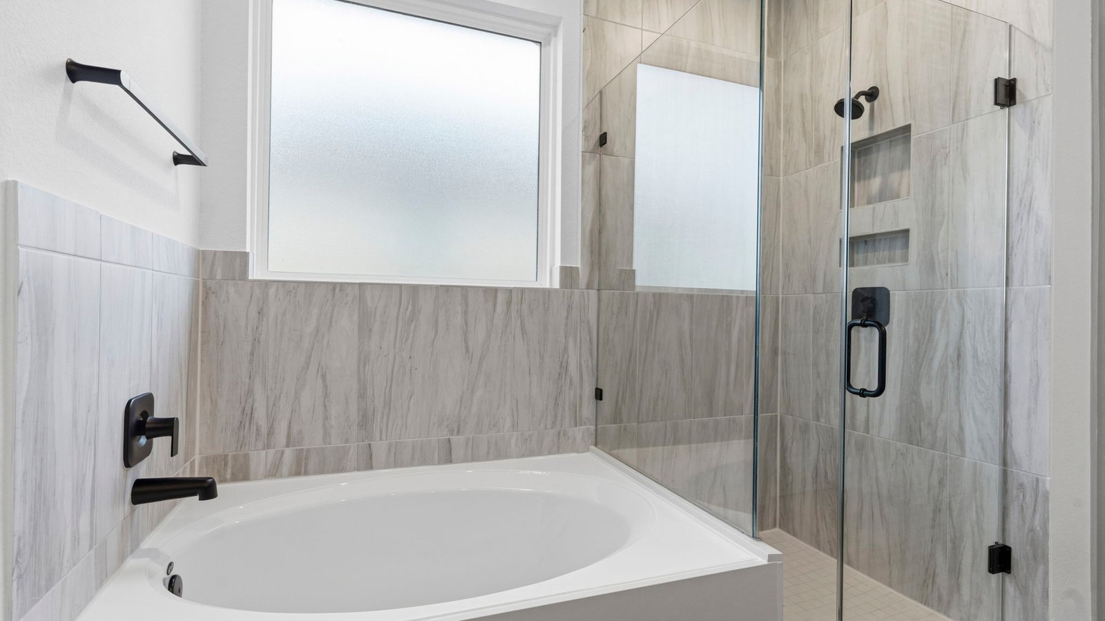 primary bathroom tub and shower