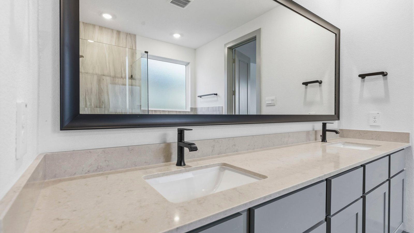 primary bathroom vanity with two sinks