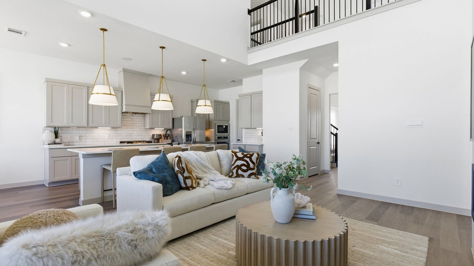 Kitchen adorned with painted cabinets seamlessly integrated into an open dining area layout.