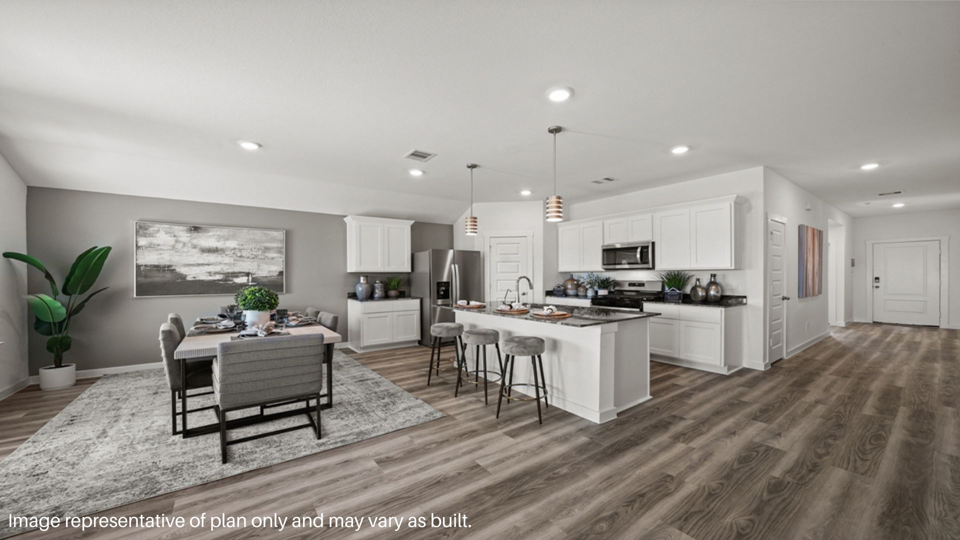 Open concept living and dining space with vinyl flooring.