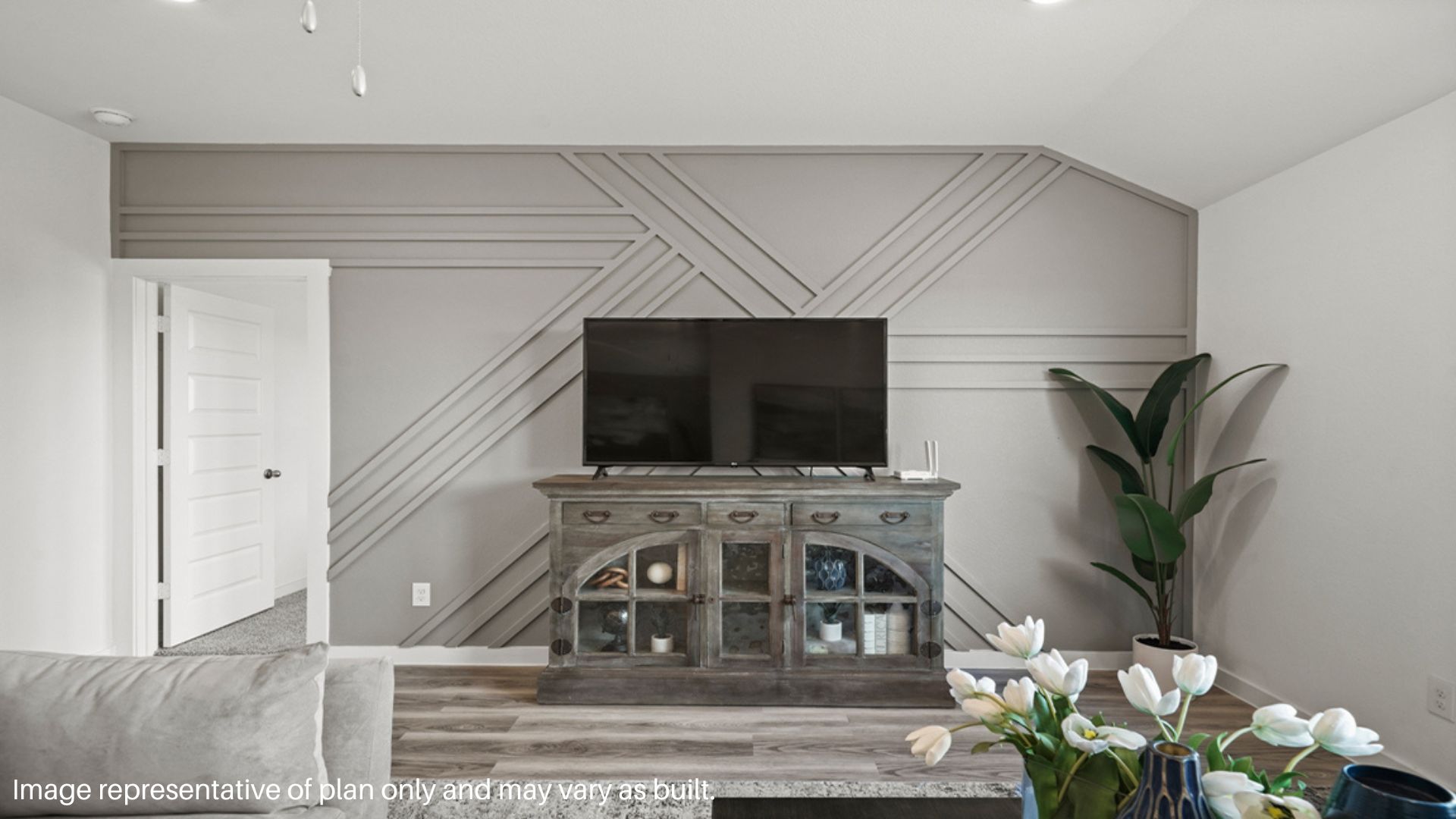 Spacious living room with large windows and plenty of space to entertain