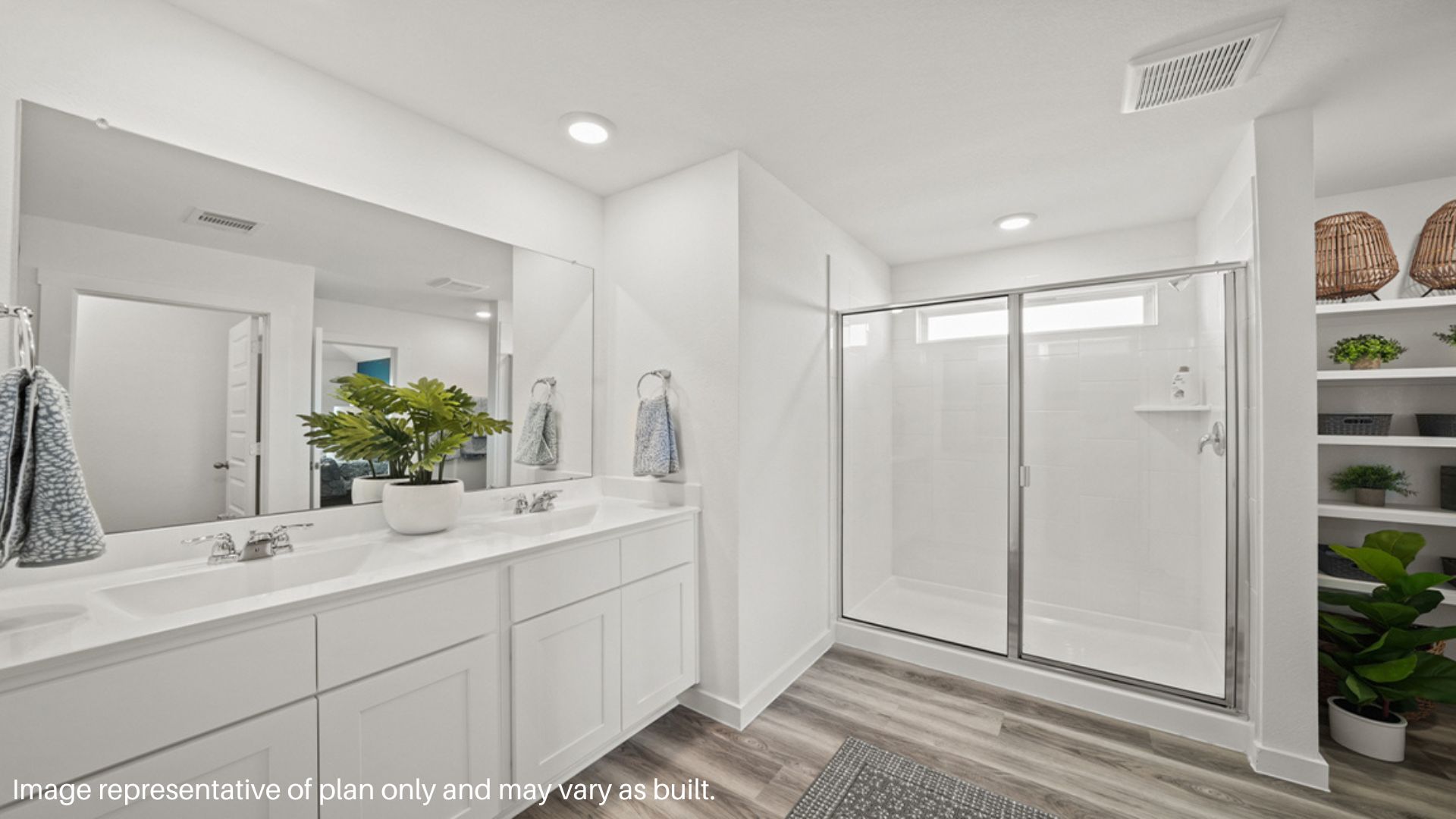 Primary bathroom with walk in shower with glass doors