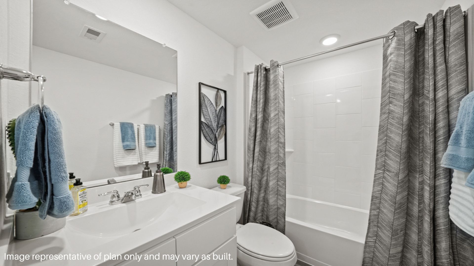 Single vanity in secondary bedroom with tub and shower combo