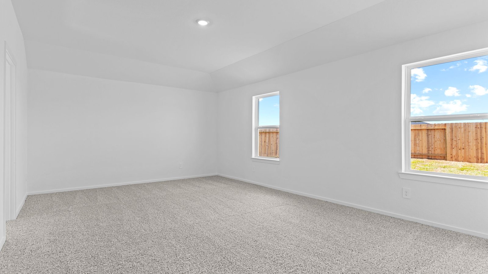 primary bedroom with two windows