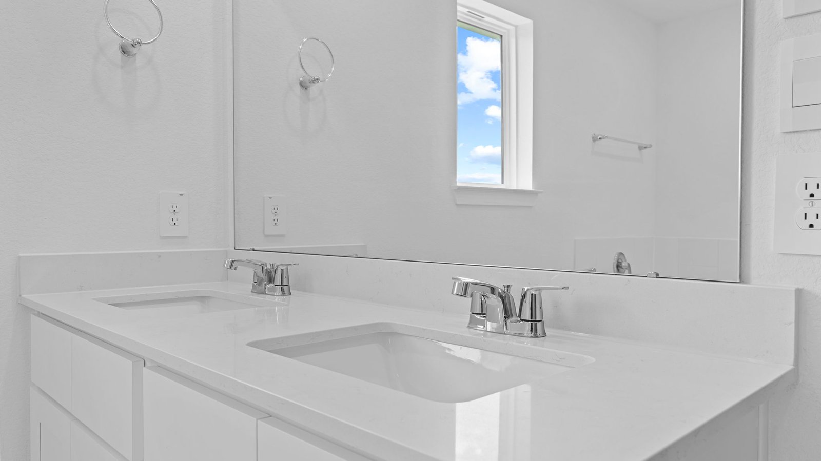 primary bathroom vanity with two sinks