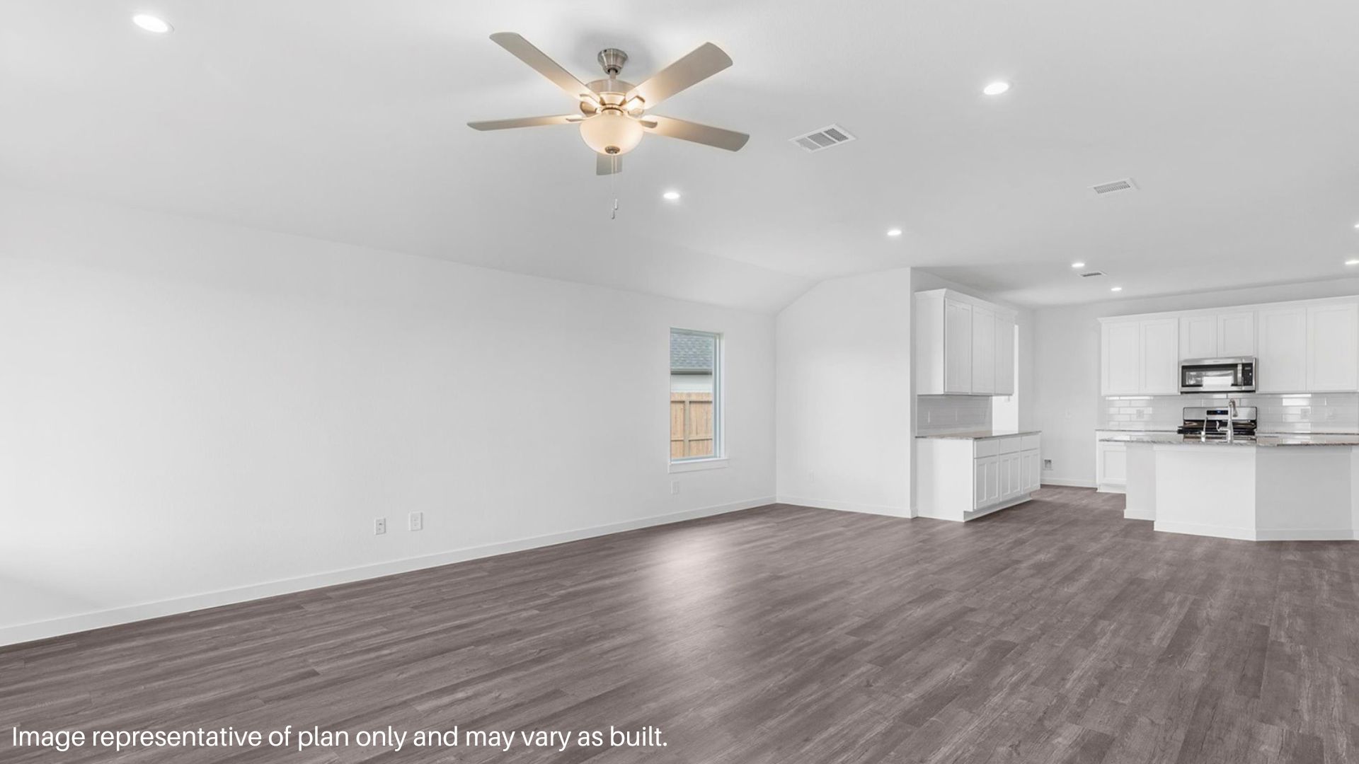 Spacious living room the overlooks the kitchen