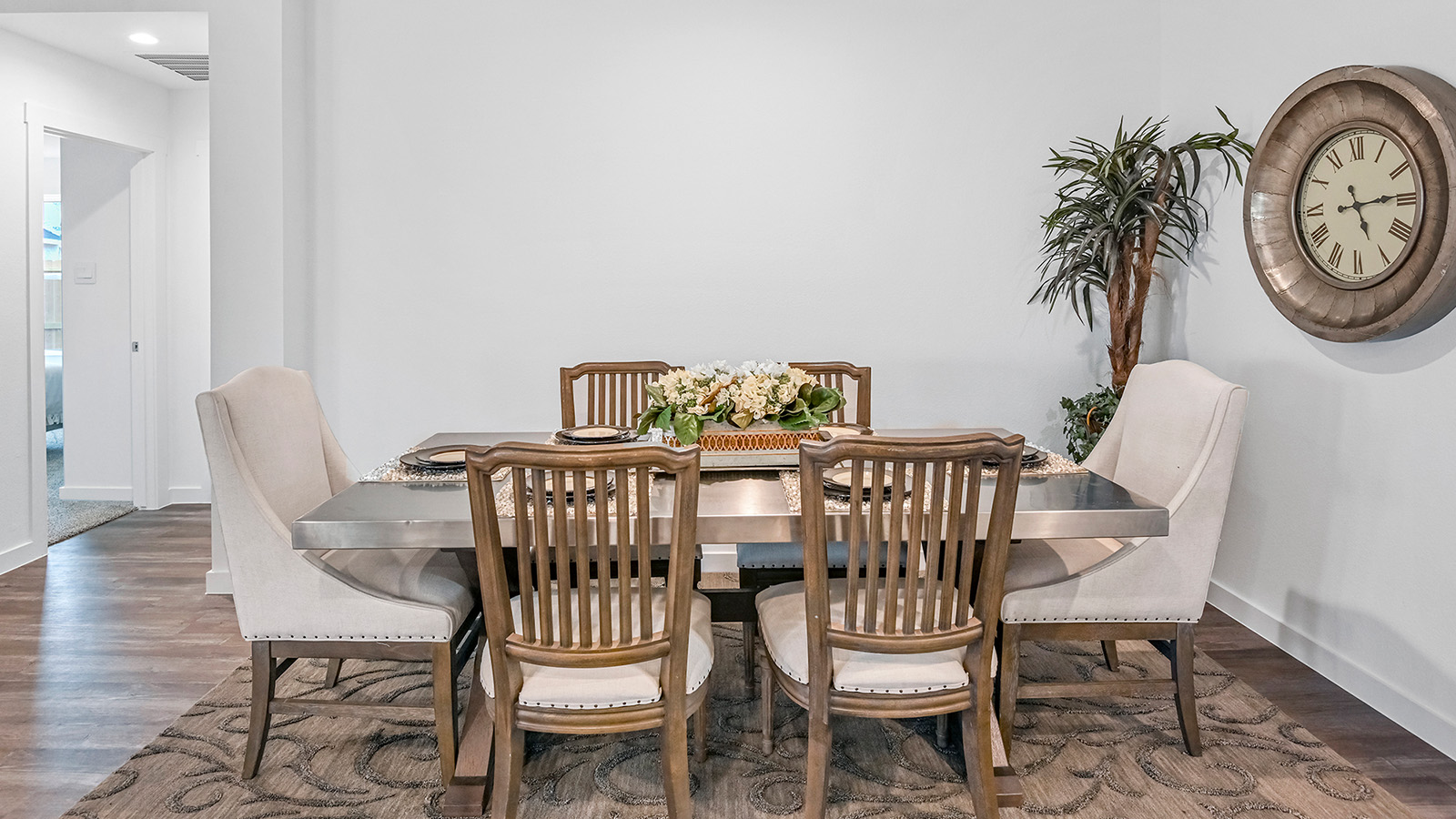 Spacious open concept dining area with vinyl wood flooring and access to the living and kitchen areas