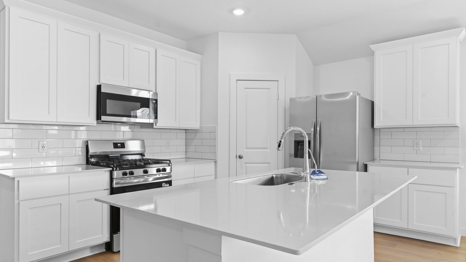 Kitchen adorned with painted cabinets seamlessly integrated into an open dining area layout.