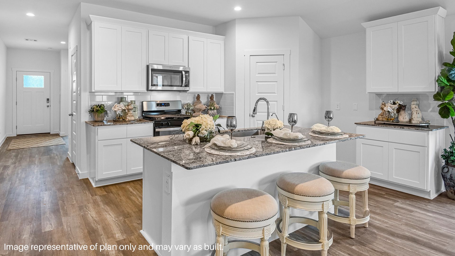 Center island with Granite countertops and plenty of Cabinets