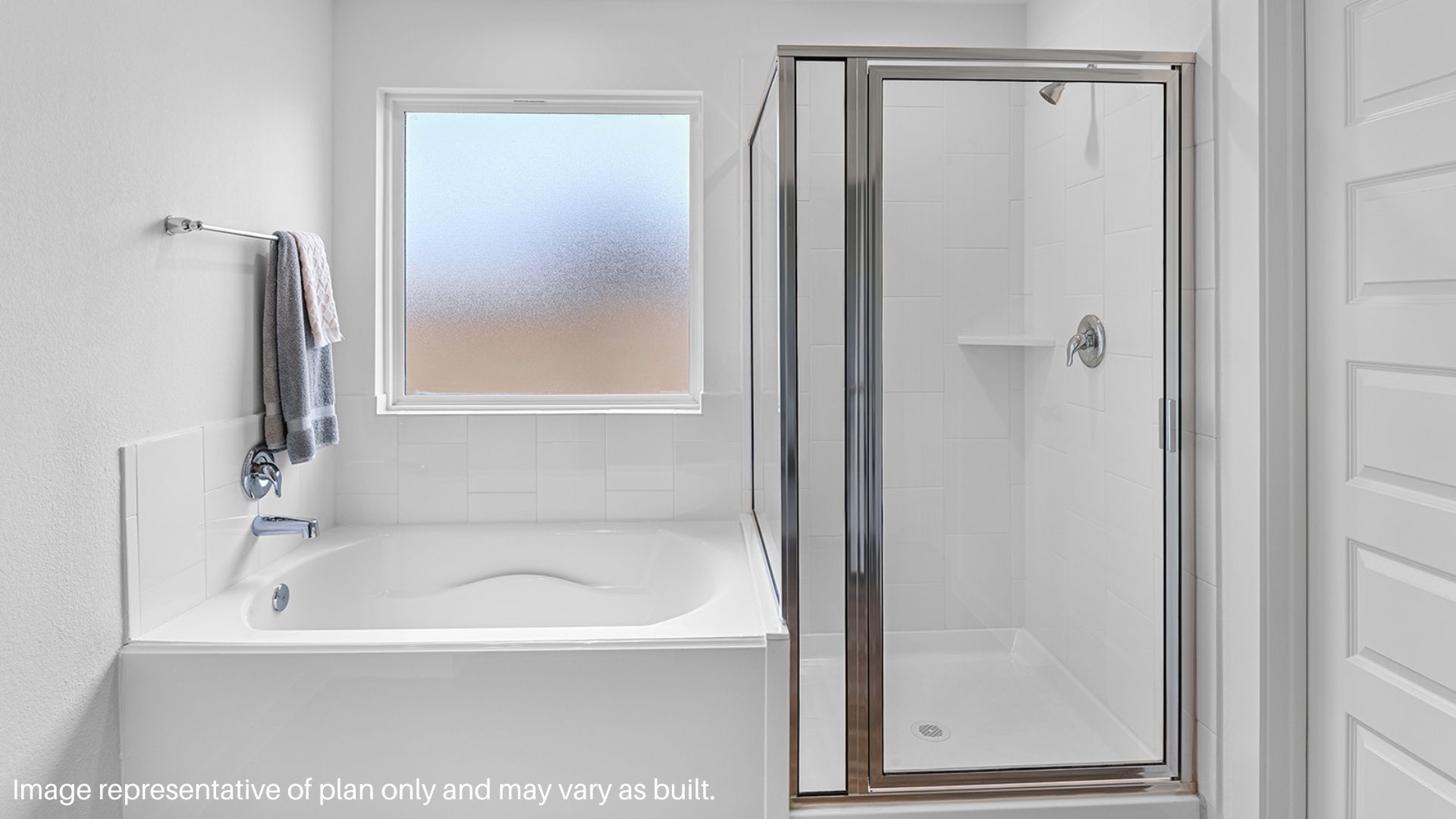 Tub and Shower in the primary bathroom