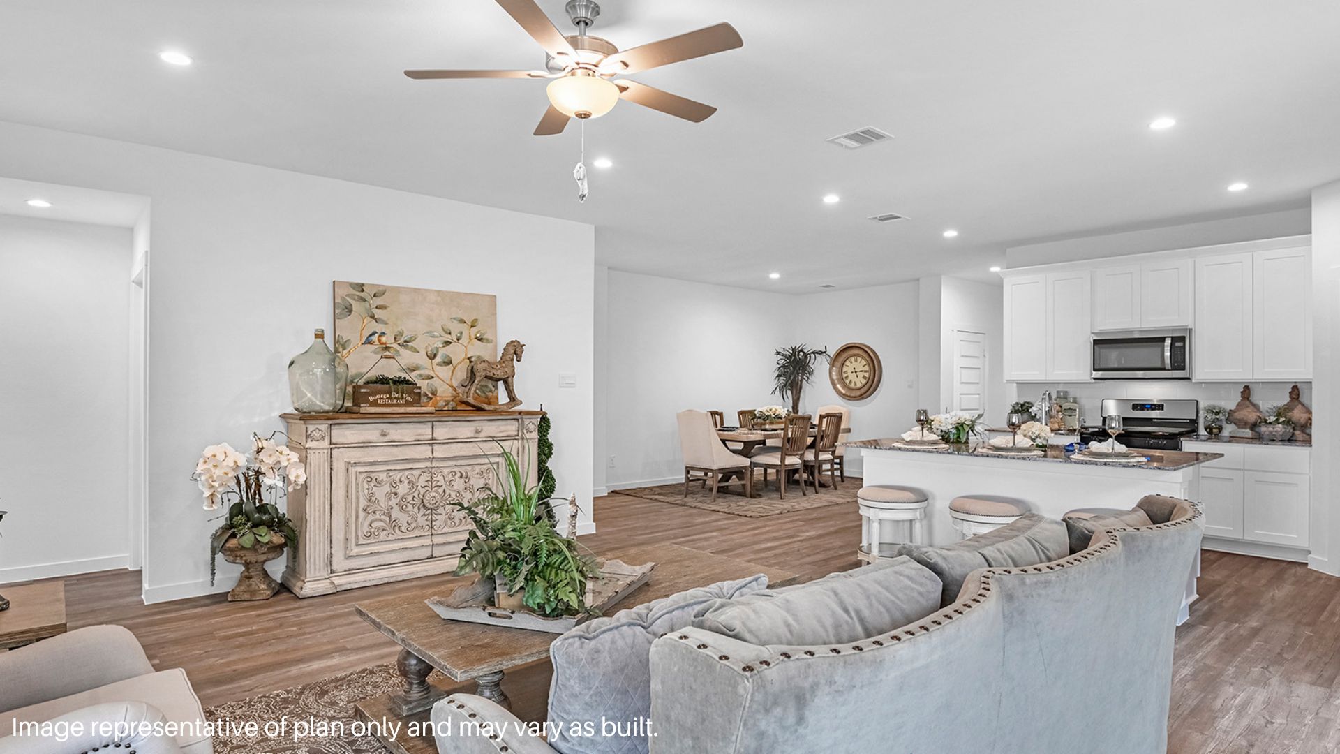 Spacious living room that overlooking the Kitchen with White Cabinets