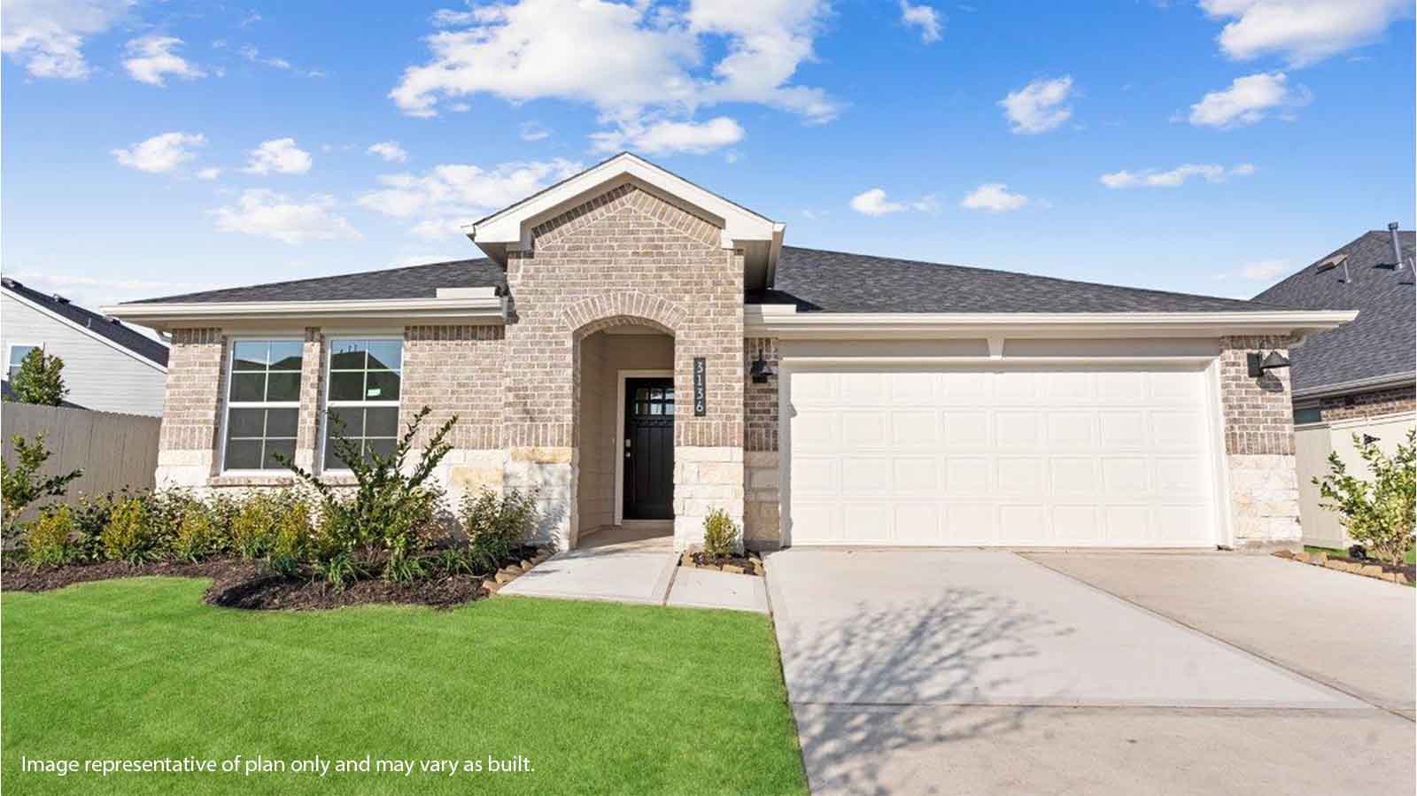 Single story brick home with a two car garage