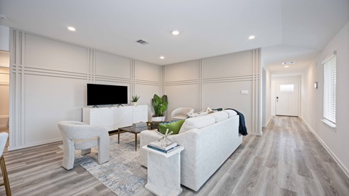 Open concept living room with two windows