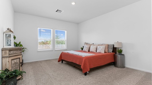 Primary bedroom with two windows