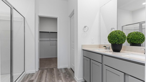 Primary bathroom with a stand alone shower and two sinks