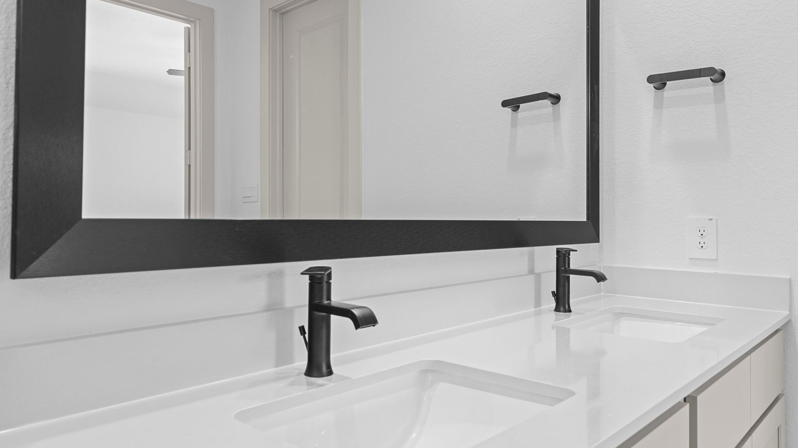 primary bathroom vanity with two sinks